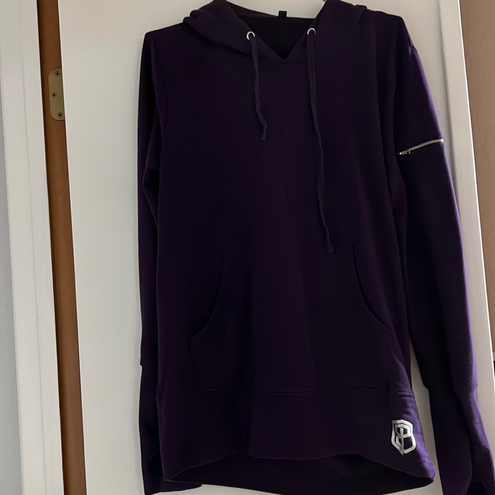 Born primitive, purple hoodie.
